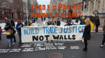 Trade Justice Not Wall protest on Inauguration Day defines what trade justice requires knowing Trump was withdrawing from TPP. Our battle now is making trade that protects people and planet. Photo: Popular Resistance.