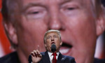 Trump speaking in front of a picture of his own face at the Republican National Convention in July 2016. Photograph Carolyn Kaster-AP