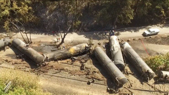 AP Crumpled oil tankers lie beside the railroad tracks after a fiery train derailment on June 3, 2016, that prompted evacuations from the tiny Columbia River Gorge town of Mosier, Ore.