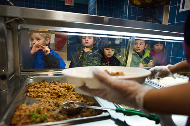 Food is served to students at Public School 397 in New York, November 21, 2013. (Photo: Joshua Bright / The New York Times)