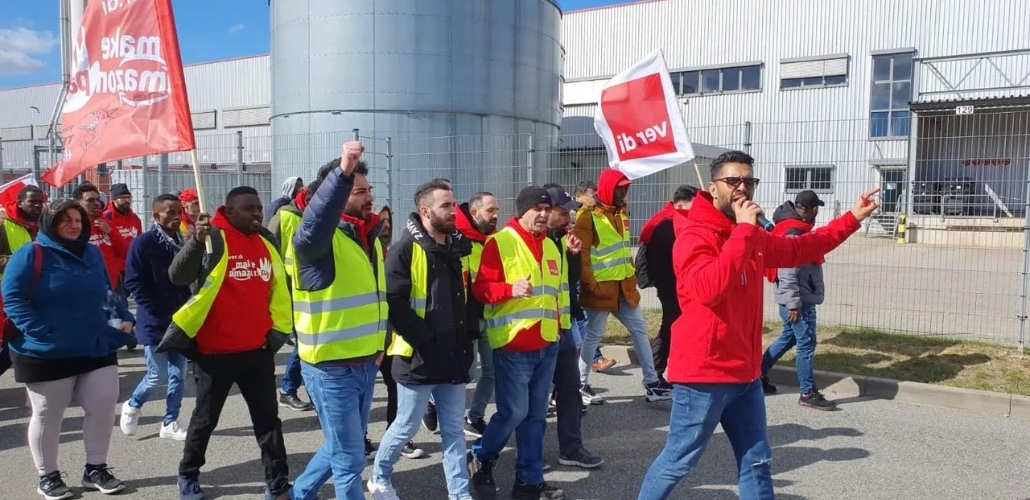 German Amazon Workers Organize To Get Paid For Every Minute